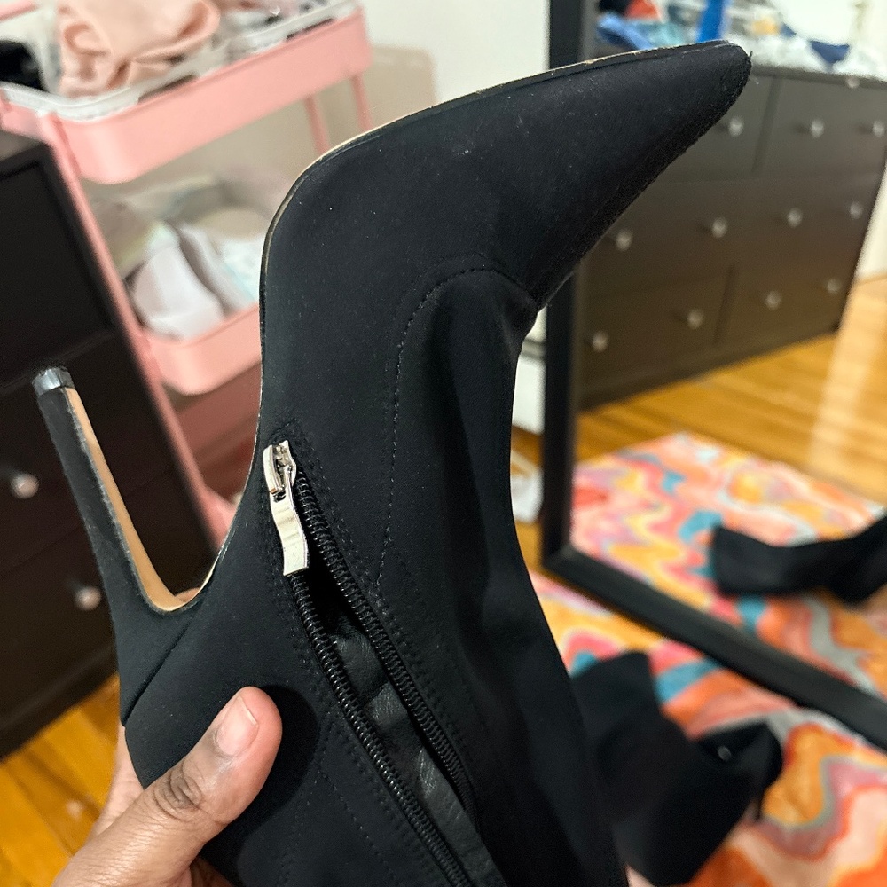 Black thigh high heeled boots